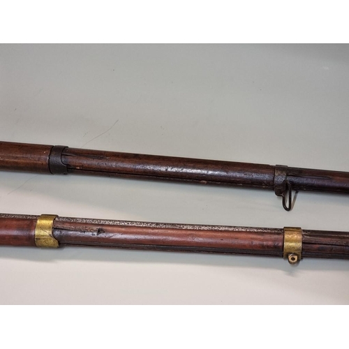 1707 - A mid 19th century French musket, marked St Etienne; together with a similar reproduction example, (... 