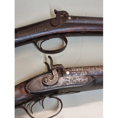 1708 - Two 12 bore double barrel percussion shotguns, (both in poor condition).