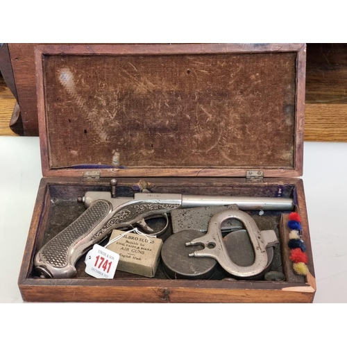 1741 - A rare Bergman chrome plated .177 air pistol, in wood box with cocking tool and related items.... 