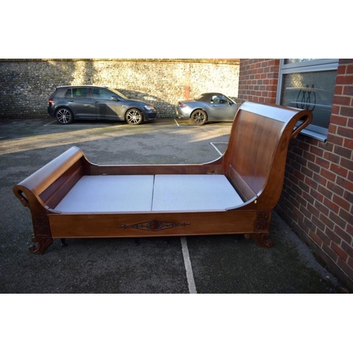 1040A - A Continental mahogany sleigh bed, with swan's head decoration, 245cm long x 150cm wide.... 