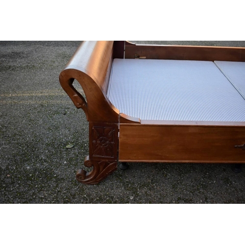 1040A - A Continental mahogany sleigh bed, with swan's head decoration, 245cm long x 150cm wide.... 