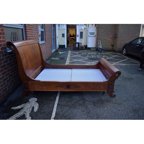 1040A - A Continental mahogany sleigh bed, with swan's head decoration, 245cm long x 150cm wide.... 