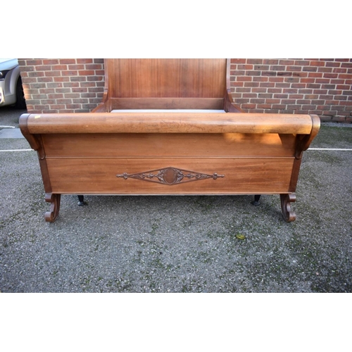 1040A - A Continental mahogany sleigh bed, with swan's head decoration, 245cm long x 150cm wide.... 