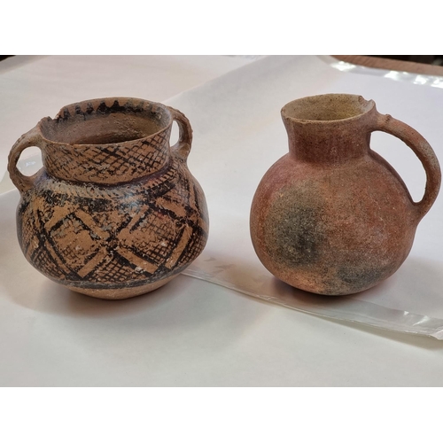 1245 - Antiquities: two pottery vessels, probably Roman, largest 13cm high, (rim chips).