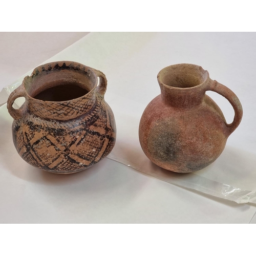 1245 - Antiquities: two pottery vessels, probably Roman, largest 13cm high, (rim chips).