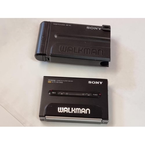 1249 - A Sony Walkman WM-501, (glued repair to battery flap), with carrying case. ... 