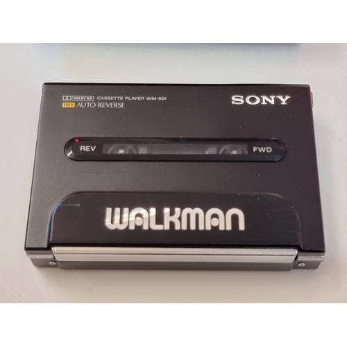 1249 - A Sony Walkman WM-501, (glued repair to battery flap), with carrying case. ... 