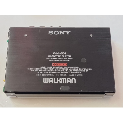 1249 - A Sony Walkman WM-501, (glued repair to battery flap), with carrying case. ... 