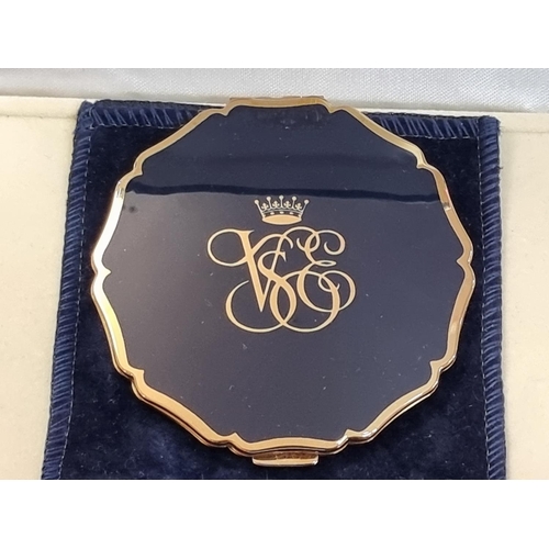 1254 - A Stratton 'Orient Express' compact mirror, with suede pouch and box. 