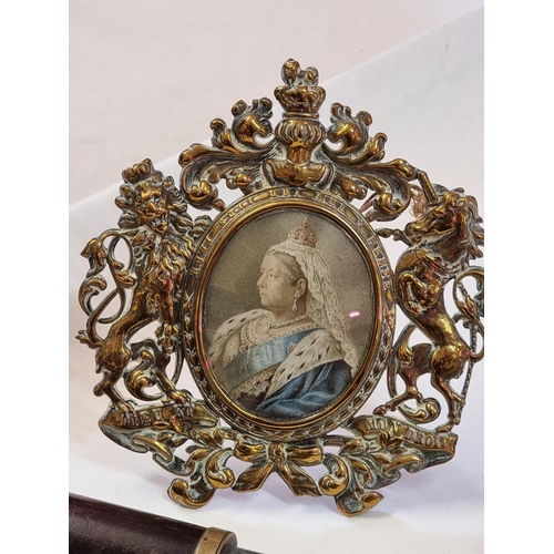 1255 - A brass framed printed miniature of Queen Victoria, the whole 13.5cm wide; together with a small cop... 