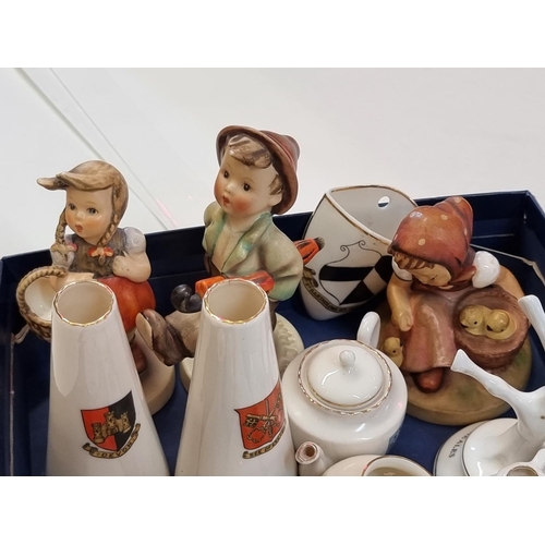 1262 - Three Hummel figures; together with a small quantity of crested china.