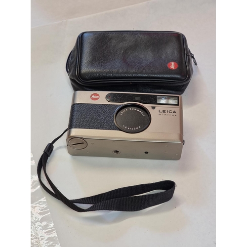 1263 - A Leica Minilux camera, with leather case.