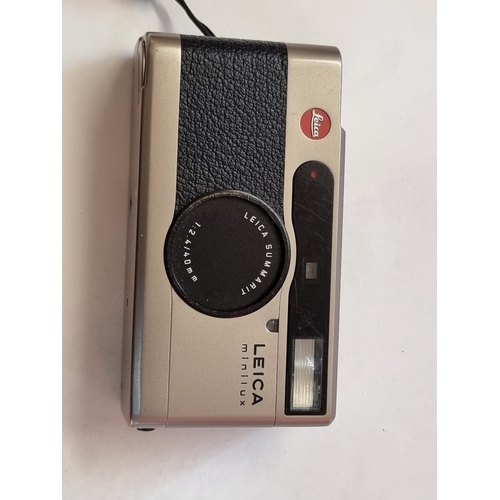 1263 - A Leica Minilux camera, with leather case.