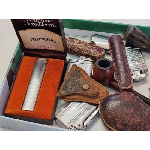 1267 - A collection of lighters, pipes and related. 