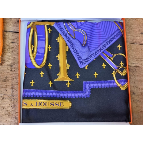 1704 - Hermes: a purple silk 'Selles a Housse' scarf, in original box with booklet; together with Hermes pa... 