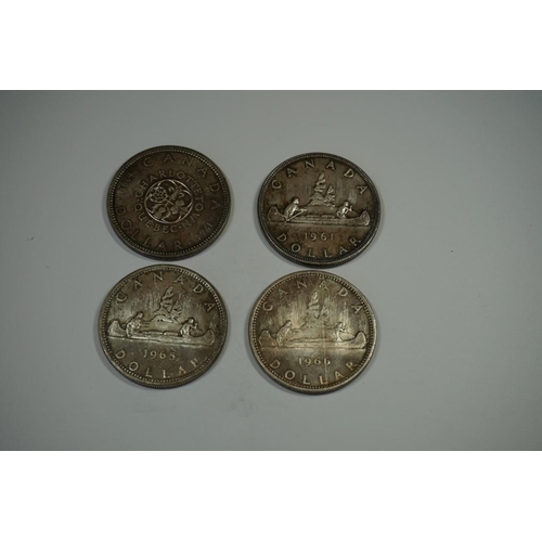 426 - Coins: four Canadian .800 silver dollars; comprising 1961; 1964; 1965 and 1966.