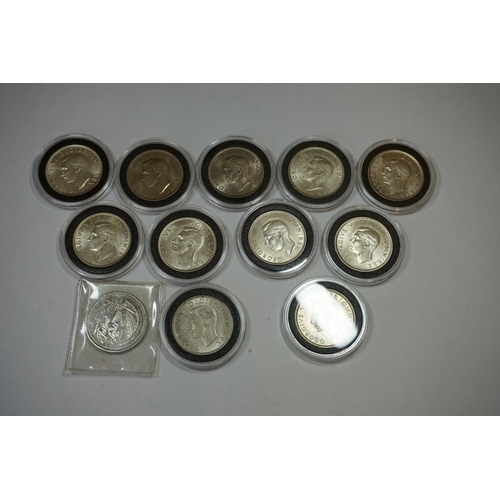 435 - Coins: eleven George VI silver and other half crown coins, including nine pre-1947; together with a ... 