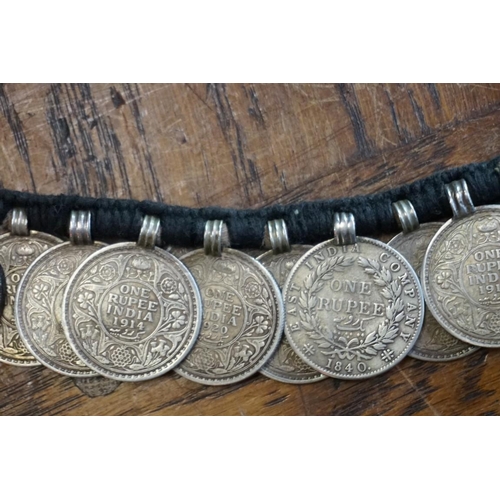 436 - Coins: an interesting Indian coin belt, having 55 William IV, Victoria and George V silver One Rupee... 