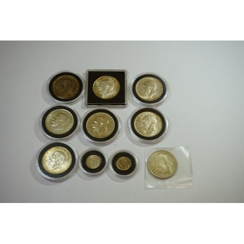 438 - Coins: ten George V silver coins, comprising eight half crowns and two threepenny bits and one Georg... 