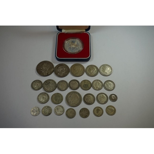 439 - Coins: a cased 1977 Silver Jubilee silver crown; together with a quantity of UK and World silver and... 