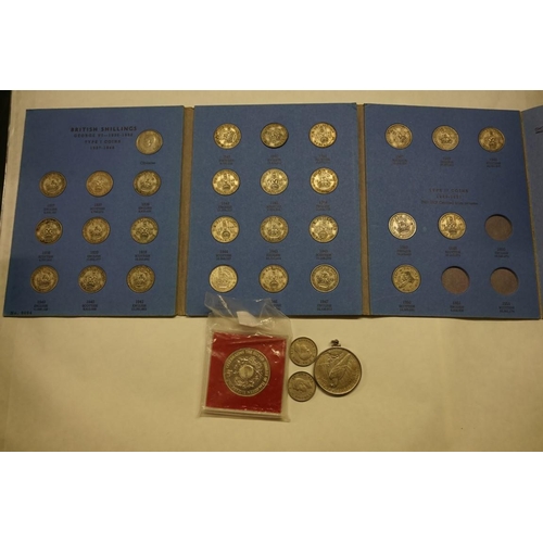 465 - Coins: a US 1922 silver peace dollar, in a pendant mount; together with an album of shillings 1937-5... 