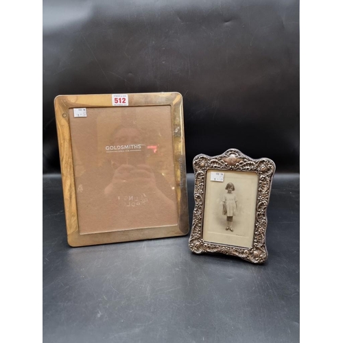 512 - A large modern rectangular photograph frame, 30 x 25cm; together with another smaller example. (2)... 