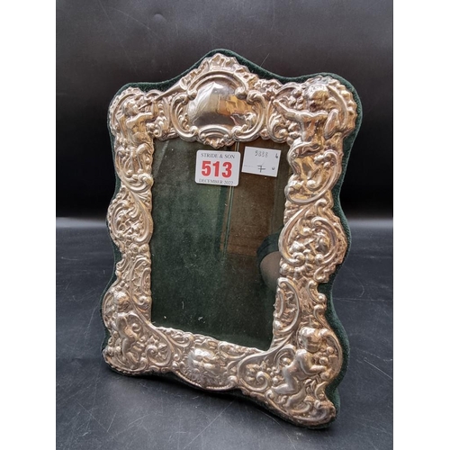 513 - A Victorian style silver photograph frame, by Ray Hall, Birmingham 1998, 24.5cm high.... 