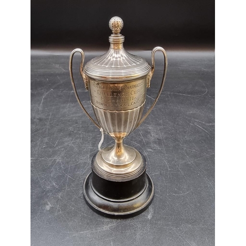 516 - A silver miniature twin handled golf trophy cup and cover, by Walker & Hall, Sheffield 1933, 13.... 