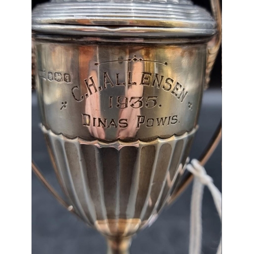 516 - A silver miniature twin handled golf trophy cup and cover, by Walker & Hall, Sheffield 1933, 13.... 