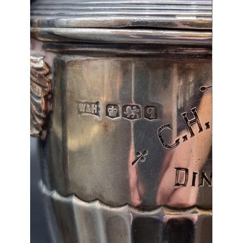 516 - A silver miniature twin handled golf trophy cup and cover, by Walker & Hall, Sheffield 1933, 13.... 