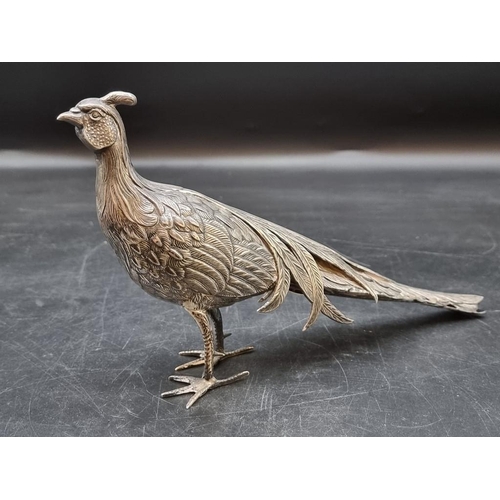 523 - A Spanish white metal pheasant, 29cm.