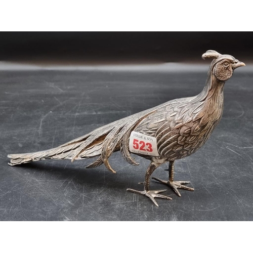 523 - A Spanish white metal pheasant, 29cm.