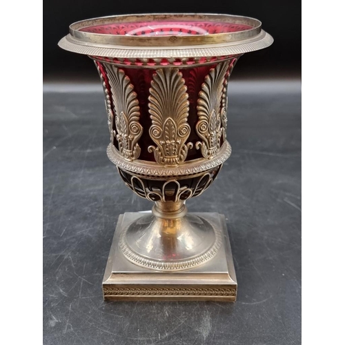 524 - An early 19th century French white metal openwork pedestal sugar bowl, having red glass liner, stamp... 