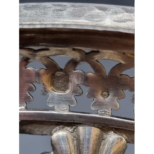 524 - An early 19th century French white metal openwork pedestal sugar bowl, having red glass liner, stamp... 