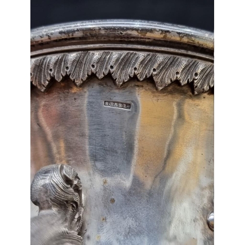 525 - An Indian Colonial repousse white metal twin handled cup, circa 1840, stamped TB & S Ltd, probab... 