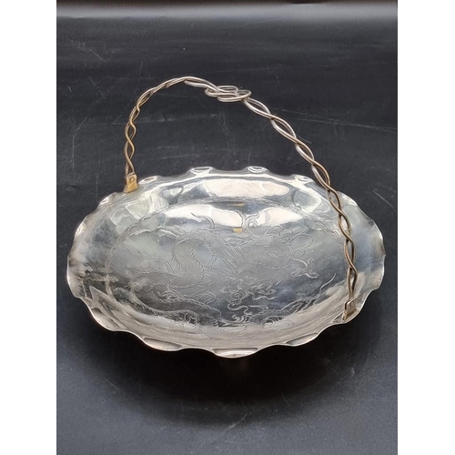 535 - A Chinese white metal swing handle bowl, stamped 'Tackhing 90% Silver', 21cm diameter.328g... 