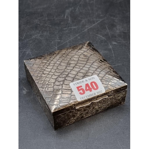 540 - An Edwardian silver cigarette box, having crocodile skin style chased decoration, by S Blanckensee &... 