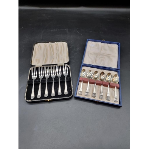 549 - A cased set of six silver George V commemorative teaspoons; together with a cased set of six silver ... 