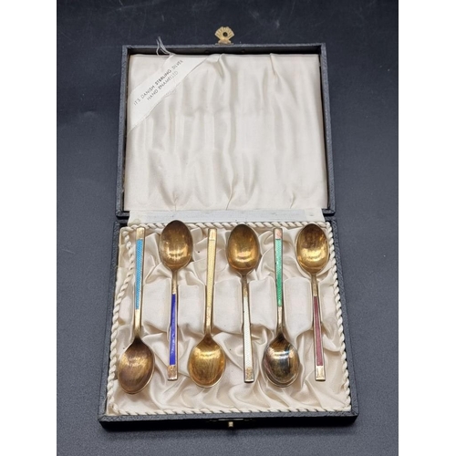 553 - A cased set of six Danish silver and enamel coffee spoons, by Meka Reklamegaver, Holte.... 