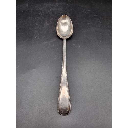 561 - A Victorian silver bead pattern serving spoon, by Chawner & Co, London 1871, 30cm, 168g.... 