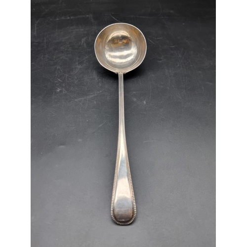 562 - A Victorian silver bead pattern soup ladle, by Chawner & Co, London 1871, 34cm, 274g.... 