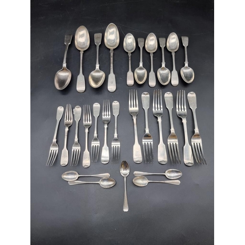 585 - A quantity of Georgian and Victorian silver fiddle pattern cutlery, different dates and makers, 1283... 