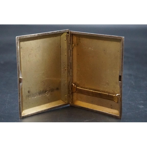 597 - A silver and yellow metal engine turned cigarette case, by Asprey, London 1936, slide opening, gross... 