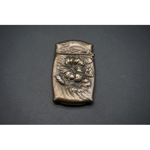 601 - A white metal vesta case, stamped 'Sterling', 6.5cm.