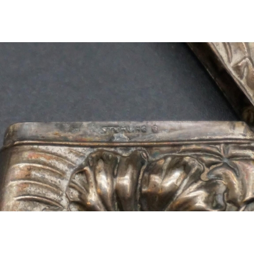 601 - A white metal vesta case, stamped 'Sterling', 6.5cm.