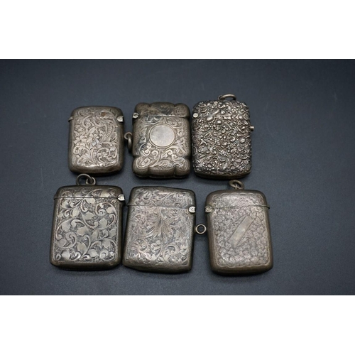 605 - Six various silver vesta cases, 142g.