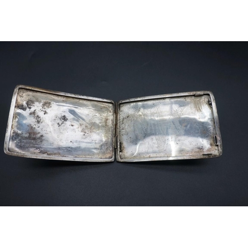 606 - An Egyptian niello cigarette case, 11.5cm; together with a child's silver teether. (2)... 