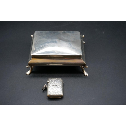 607 - A silver jewellery casket, 11cm; together with a silver vesta case. (2)