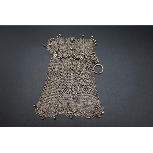 611 - A white metal mesh drawstring purse.