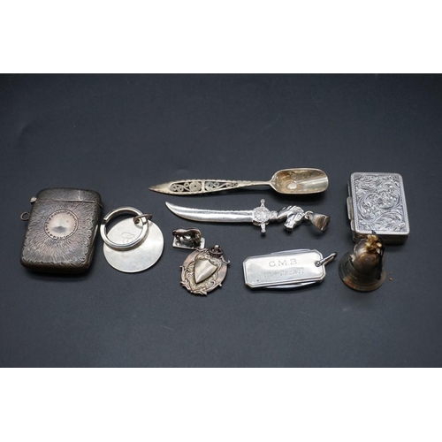 614 - A small group of silver and white metal items, to include a silver vesta case. (9)